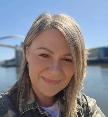A photo of Lyndsey n front of the river Tyne